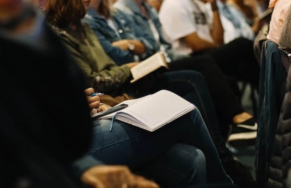 a group of people sitting in a room
