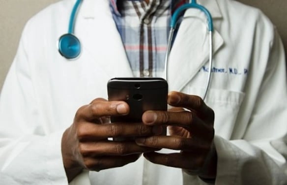 doctor with phone